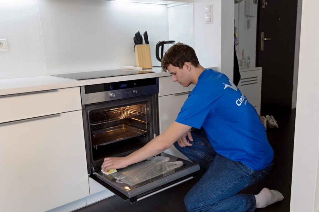 A professional cleaner at work in a Polish home, showcasing the importance of quality cleaning services.